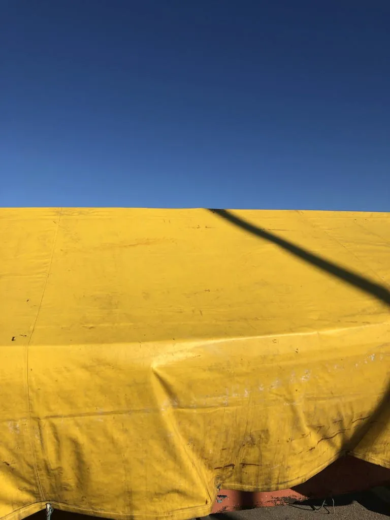 Tarpaulin Covered Boat